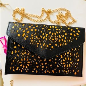 Leather envelope purse with metal strap